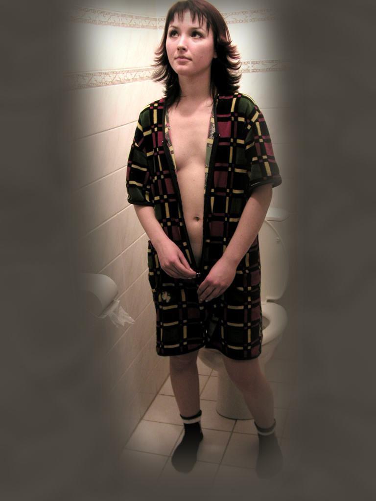 16P Cute brunette caught peeing on toilet by voyeur hidden cam