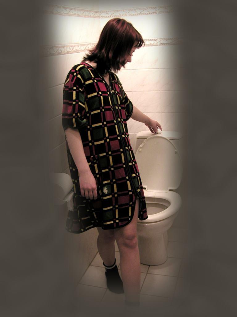 16P Cute brunette caught peeing on toilet by voyeur hidden cam