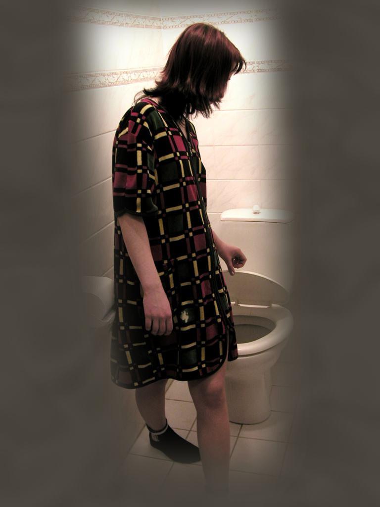 16P Cute brunette caught peeing on toilet by voyeur hidden cam