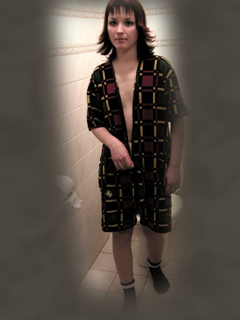 16P Cute brunette caught peeing on toilet by voyeur hidden cam