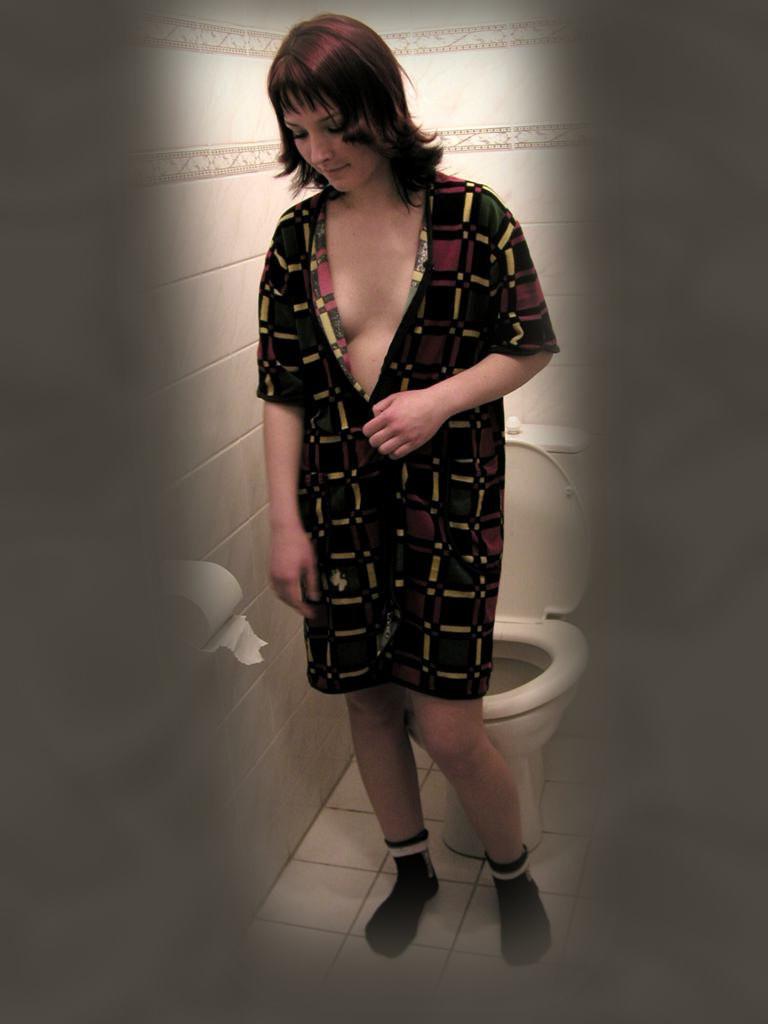 16P Cute brunette caught peeing on toilet by voyeur hidden cam
