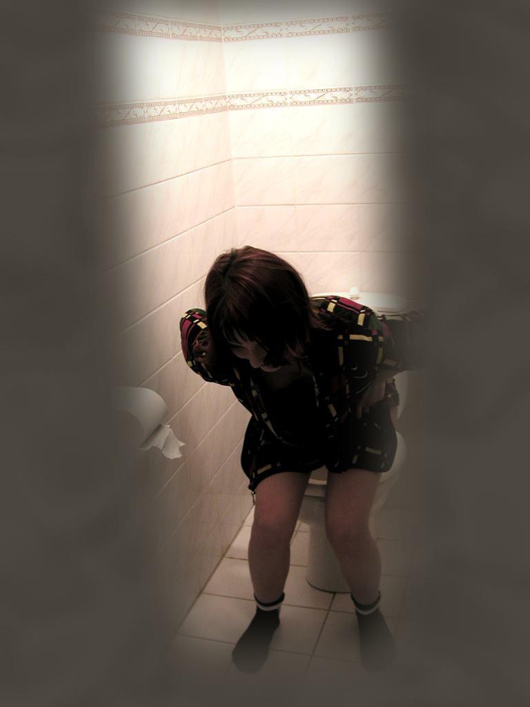 16P Cute brunette caught peeing on toilet by voyeur hidden cam