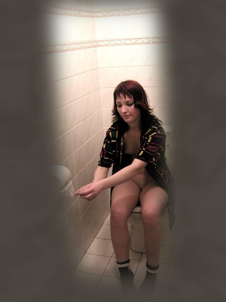 16P Cute brunette caught peeing on toilet by voyeur hidden cam