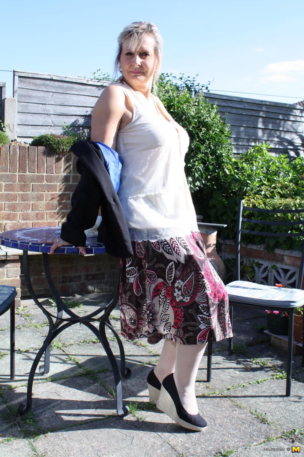 16P Horny mature lady strips in her garden