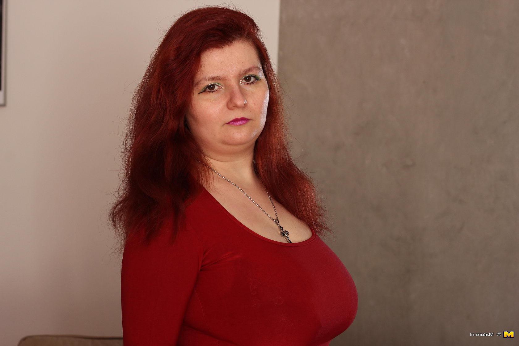 16P Big breasted mature slut getting naked