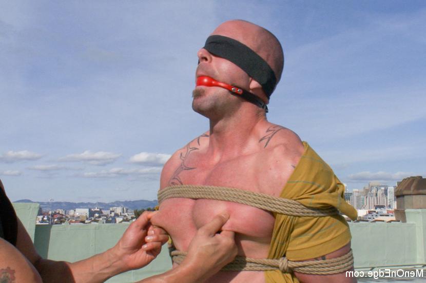 15P Muscle stud Mitch Vaughn is suspended crucifix style and edged to a point of ins