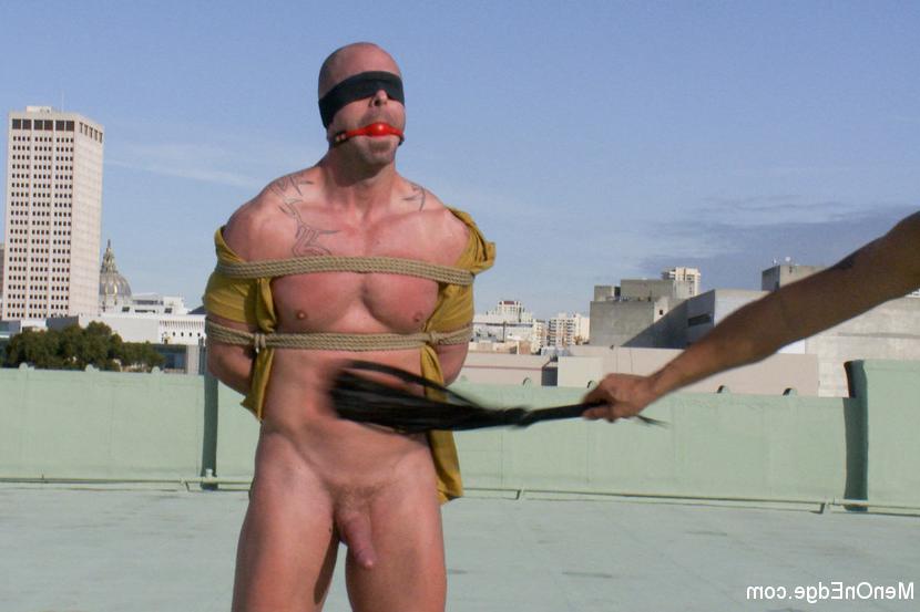 15P Muscle stud Mitch Vaughn is suspended crucifix style and edged to a point of ins