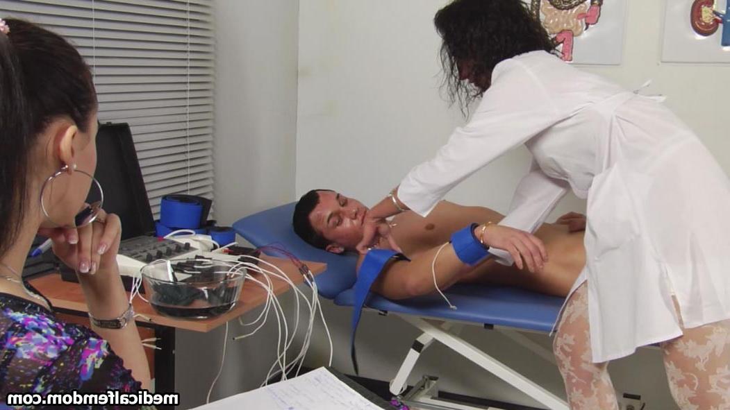 12P Tattooed guy caught by two medical dommes