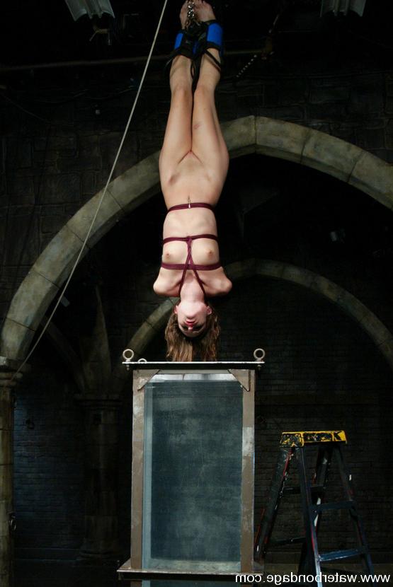 15P Petite Amber Rayne is suspended upside-down and dunked