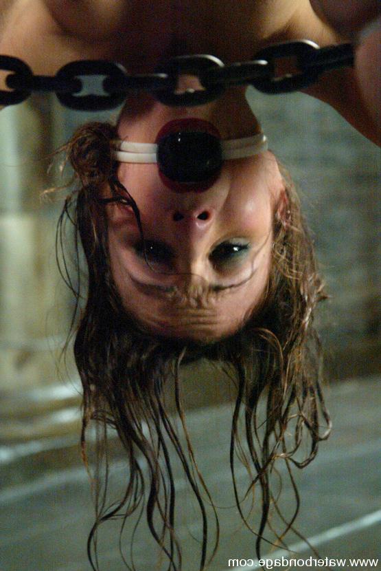 15P Petite Amber Rayne is suspended upside-down and dunked
