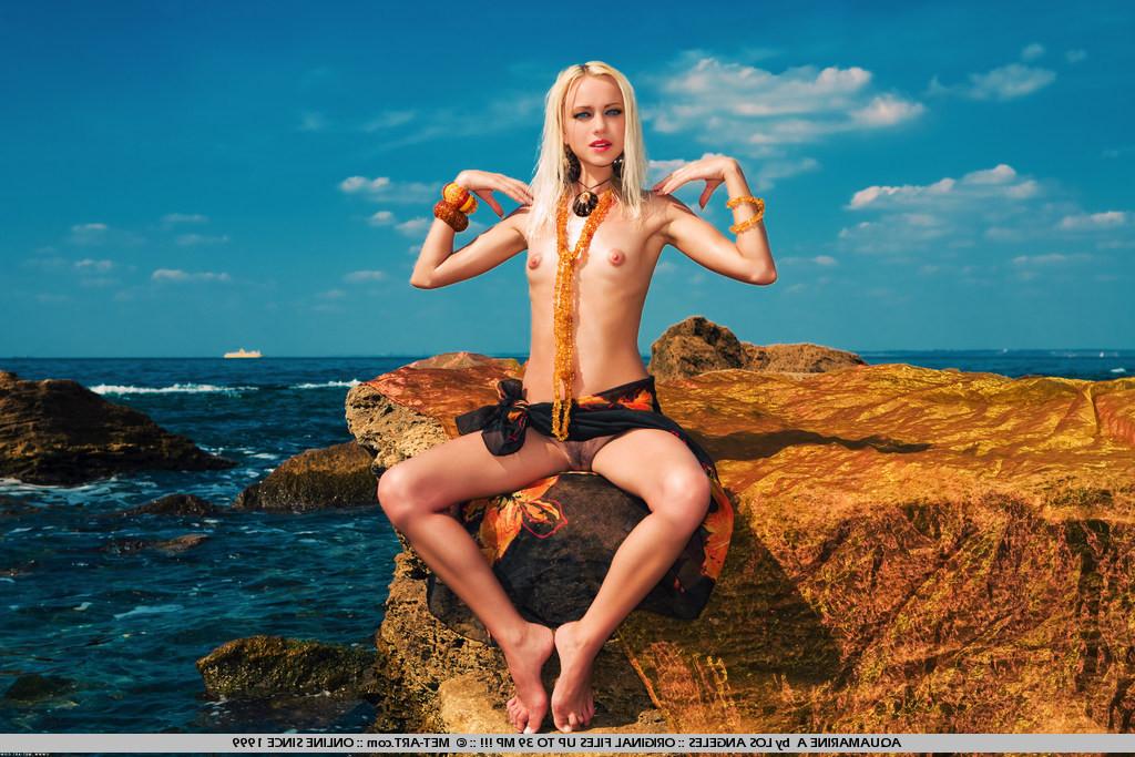 19P petite blonde poses at the beach