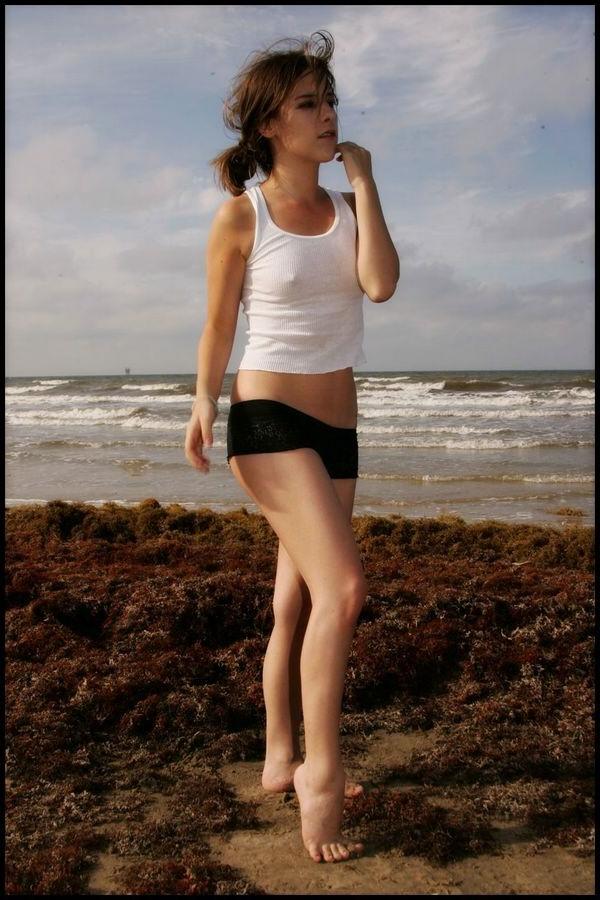 15P Sexy petite Nicole Sparks posing at the beach all wet