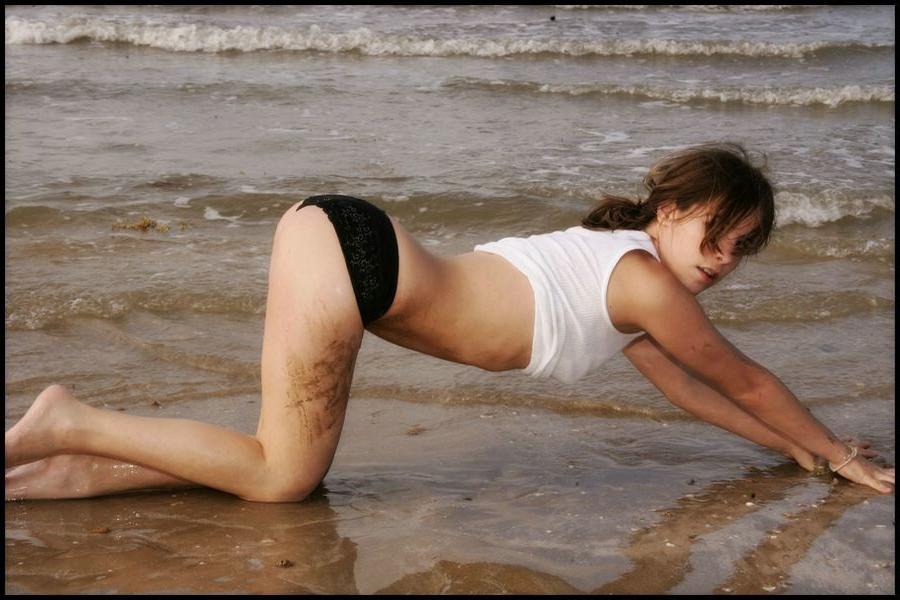 15P Sexy petite Nicole Sparks posing at the beach all wet