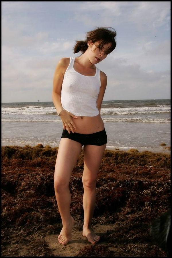 15P Sexy petite Nicole Sparks posing at the beach all wet
