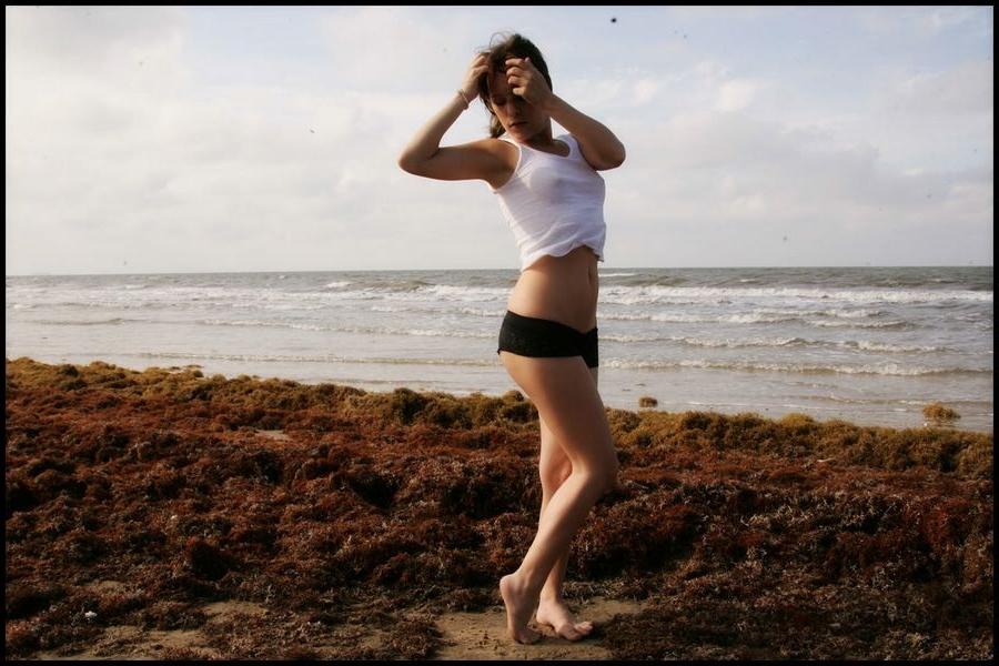 15P Sexy petite Nicole Sparks posing at the beach all wet