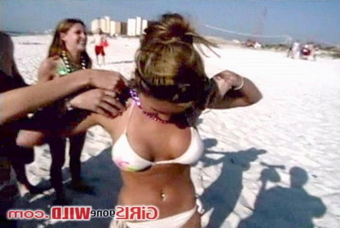 10P Cutie at the beach shows us her perky tits