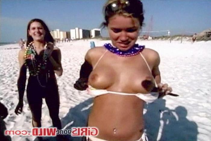 10P Cutie at the beach shows us her perky tits