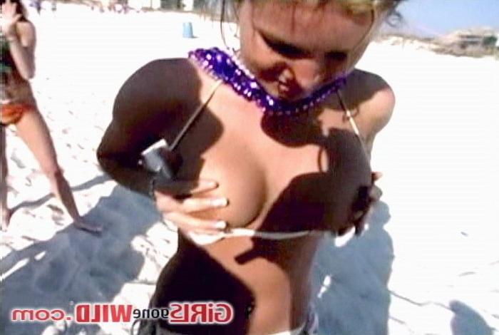 10P Cutie at the beach shows us her perky tits