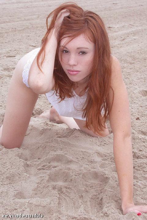 18P Sexy redhead shows her snatch on a beach