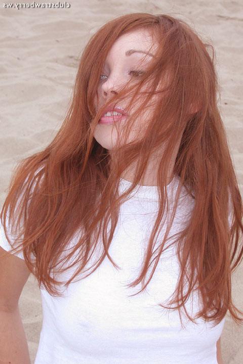 18P Sexy redhead shows her snatch on a beach