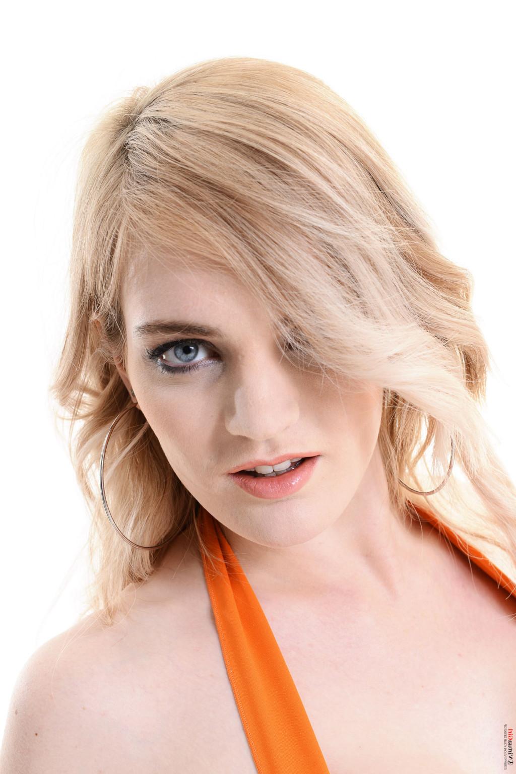 15P Busty blonde in her orange clothing and white boots