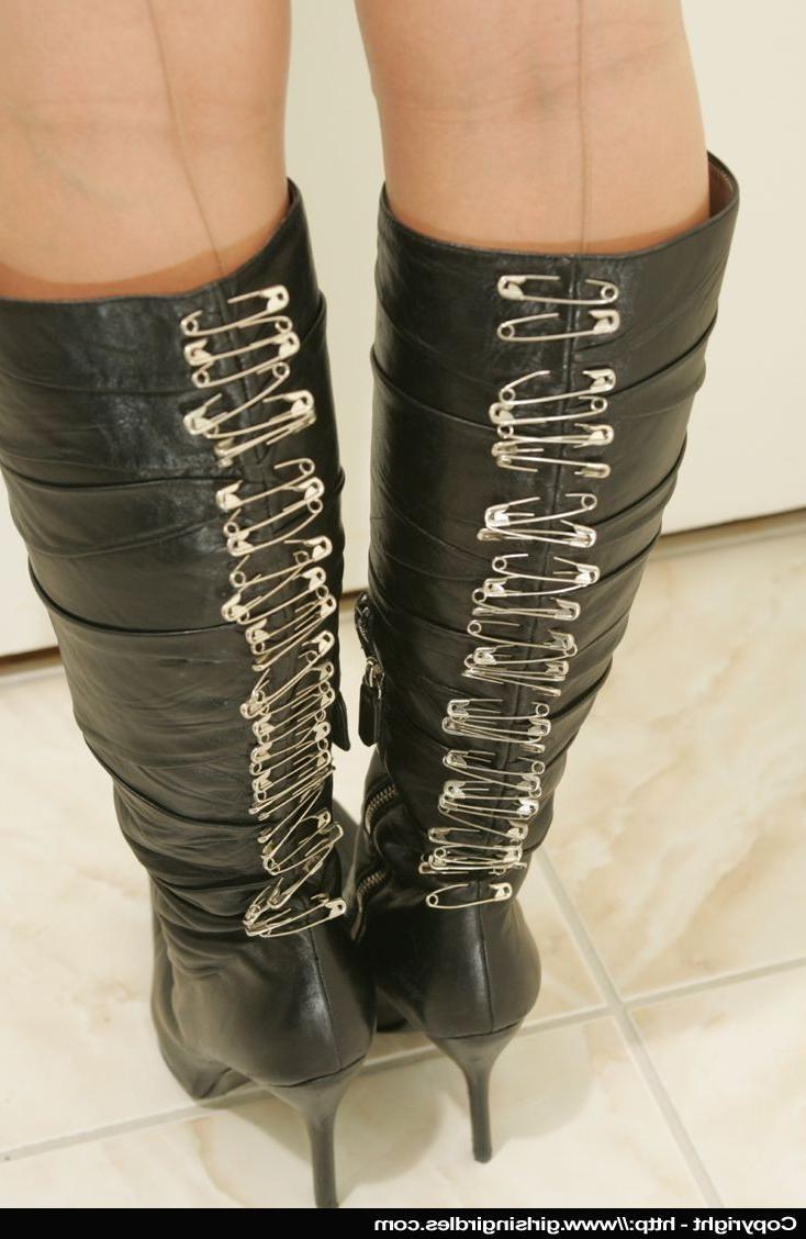 15P Naughty babe showing off in wicked boots and stockings