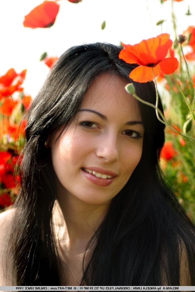 18P super foxy Melani poses out in the flower garden