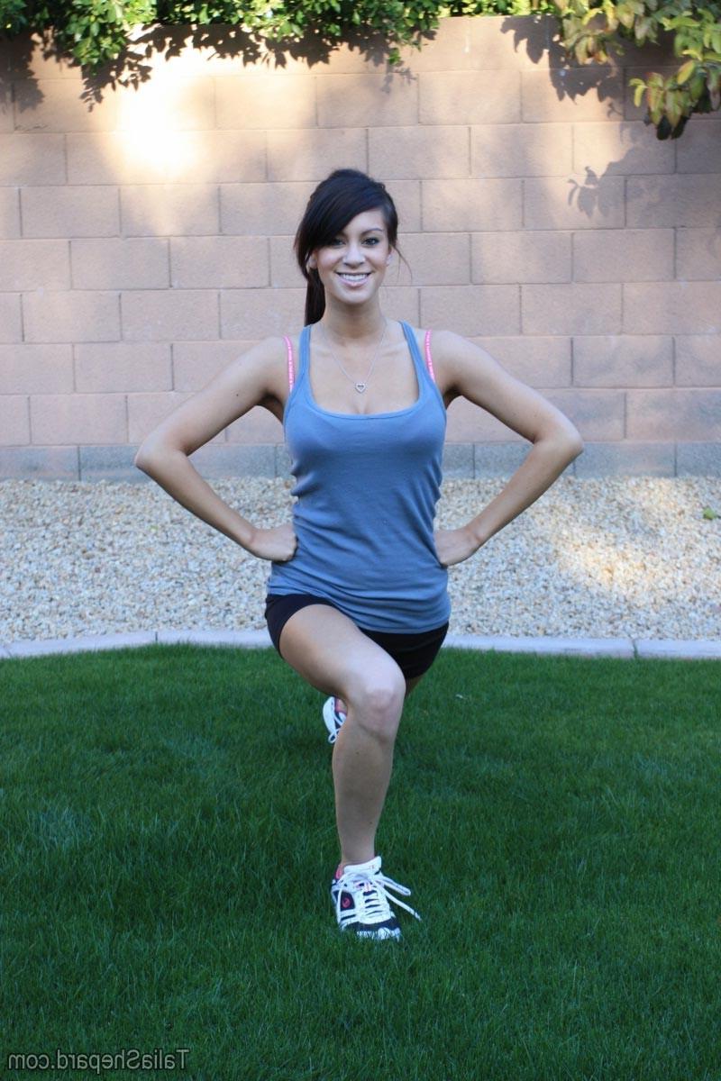 16P Hot brunette stretching outside