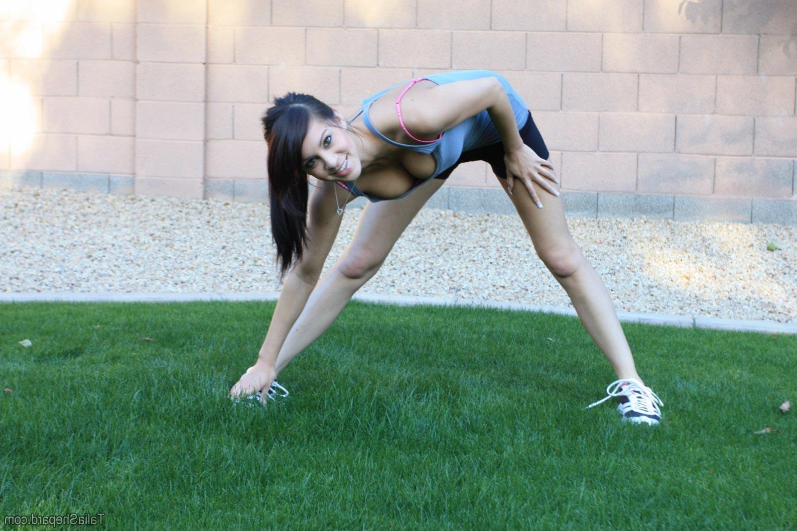 16P Hot brunette stretching outside