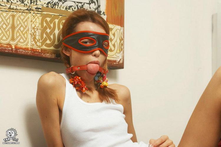 17P Pigtailed redhead lady in a mask pulling down her cute panties