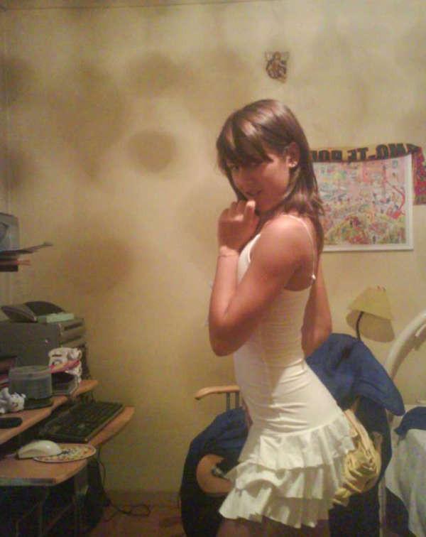 15P Pictures of a pretty teen displaying her perky breasts
