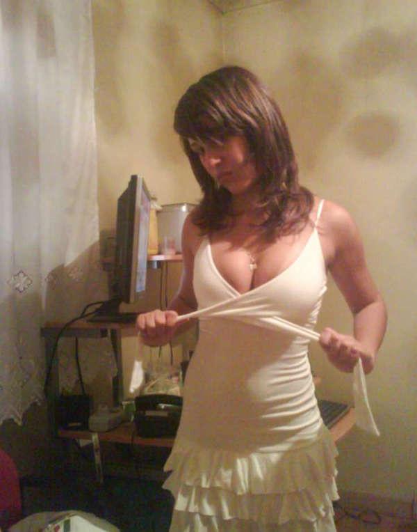 15P Pictures of a pretty teen displaying her perky breasts