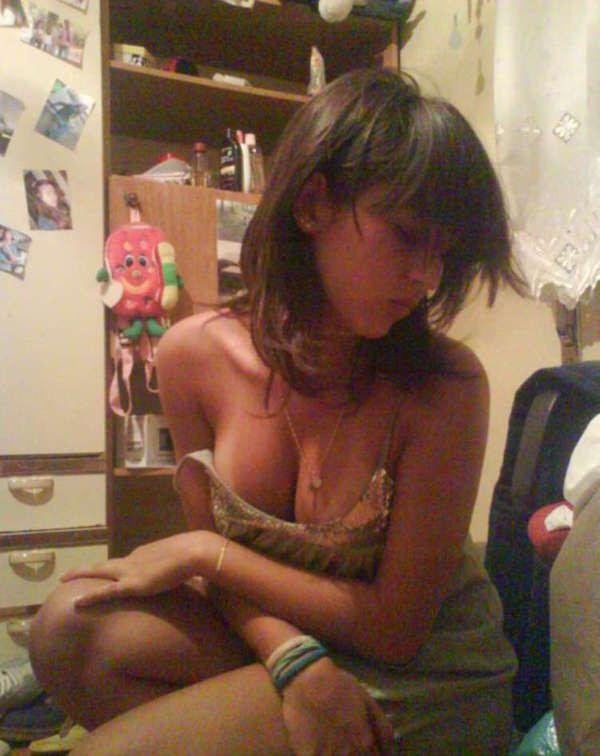 15P Pictures of a pretty teen displaying her perky breasts