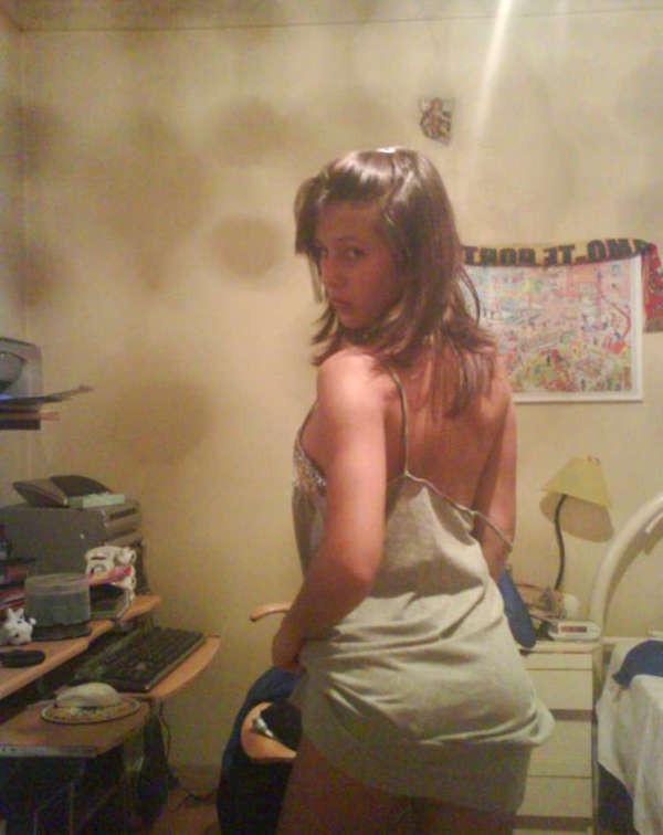 15P Pictures of a pretty teen displaying her perky breasts
