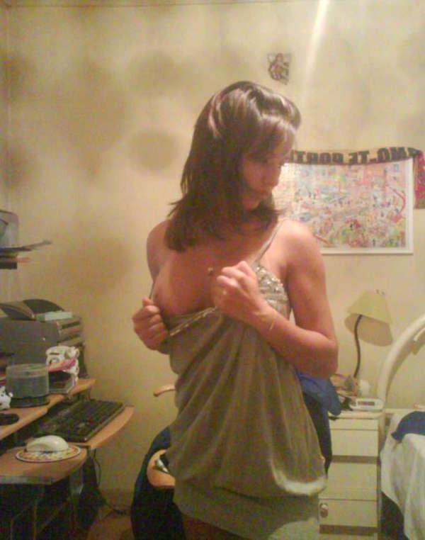 15P Pictures of a pretty teen displaying her perky breasts