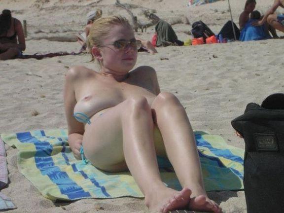 18P Sexy blonde flaunts huge tits on the beach