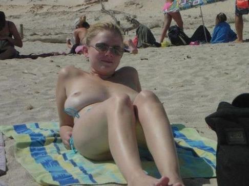 18P Sexy blonde flaunts huge tits on the beach