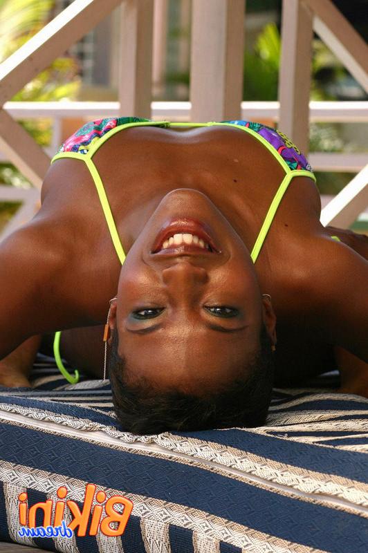 15P Bikini babe poses in the garden