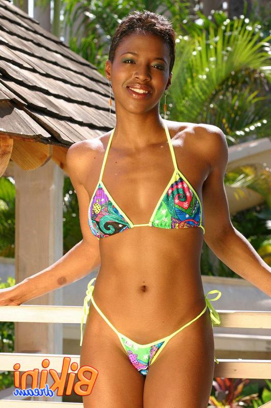 15P Bikini babe poses in the garden