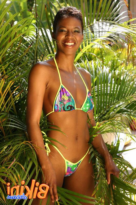 15P Bikini babe poses in the garden