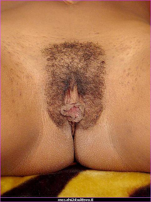 15P Nude black chick with her legs in the air