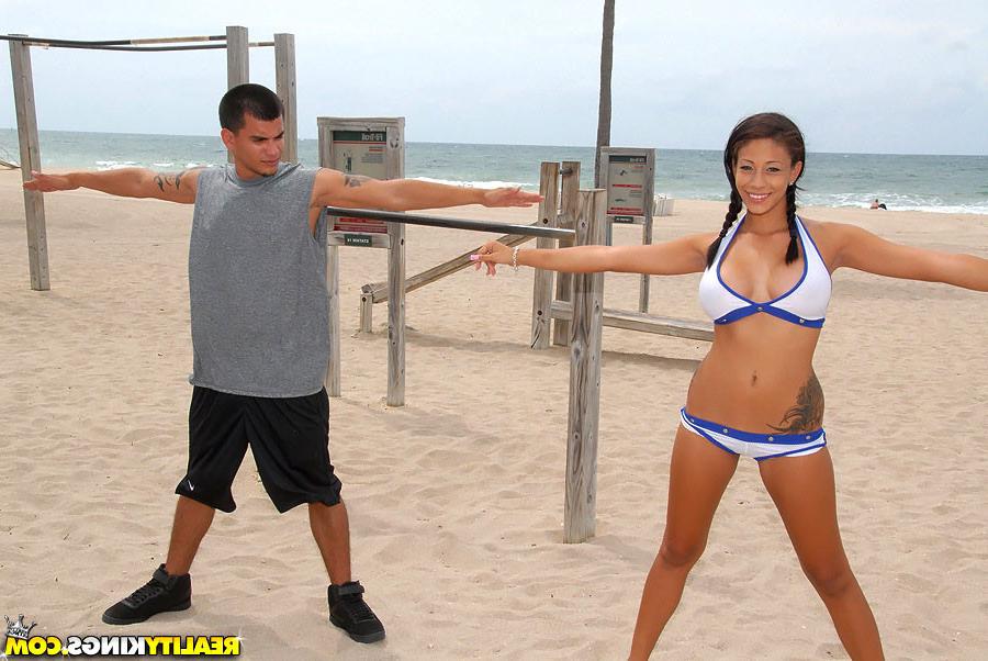 14P Check out this smoking hot beach latina stretch out on the beach in her booty sh