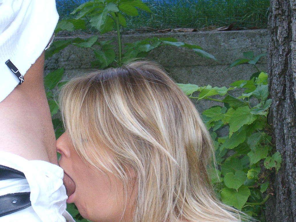 15P Blonde sucking a guy's cock in her garden