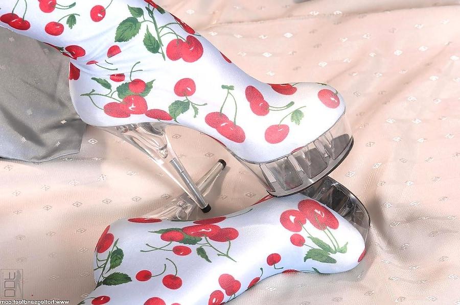 18P long legged blonde strips and poses in sexy boots