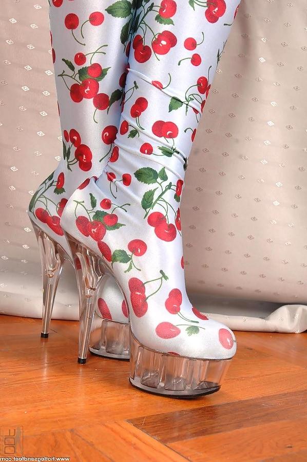 18P long legged blonde strips and poses in sexy boots