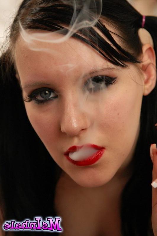 16P teen with pigtails smoking on the bed