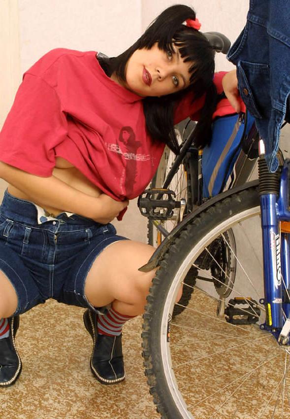 20P Pigtailed teen beauty rides bicycle