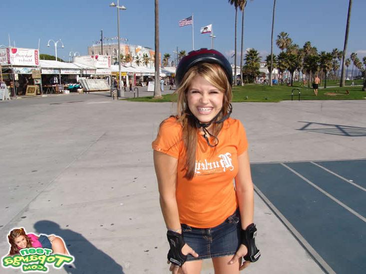 15P Brunette teen flashes her perky tits while skating