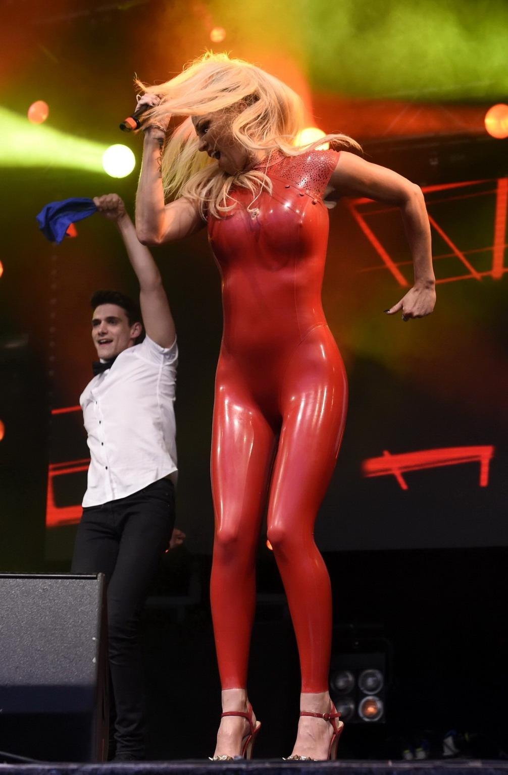 16P Sarah Harding in red latex catsuit performing at PRIDE