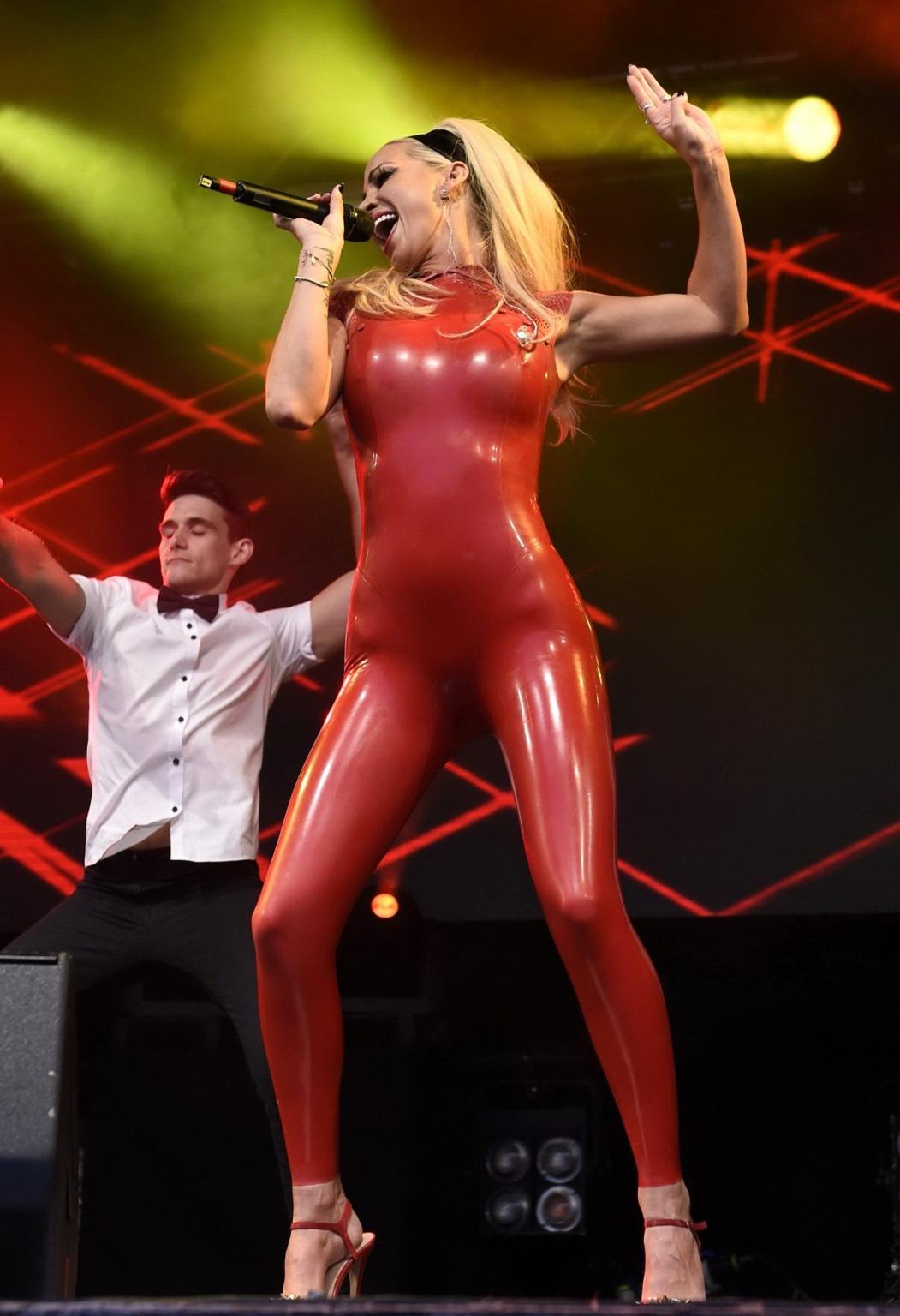 16P Sarah Harding in red latex catsuit performing at PRIDE
